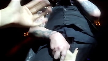 Shameless Marilyn Manson makes a lucky fan rub her hand on his dick for a live show.
